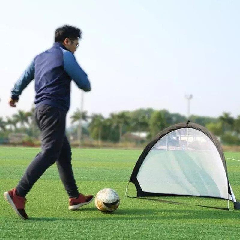 Self-deploying football cage